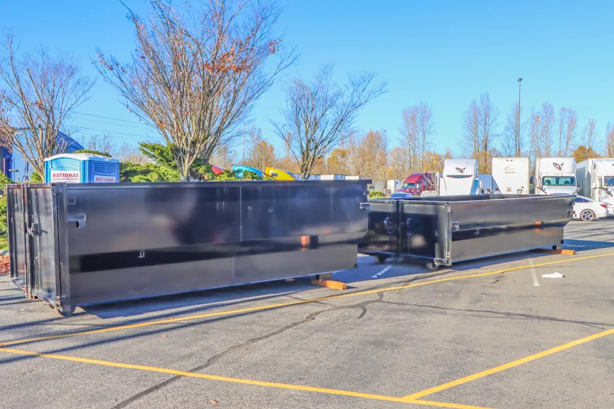 Professional dumpster rental service with roll-off container on residential driveway in Summerlin South